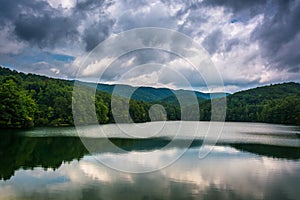 Storm clouds and mountains reflecting in Unicoi Lake, at Unicoi