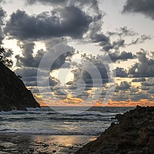 Storm clouds and ocean at sunrise