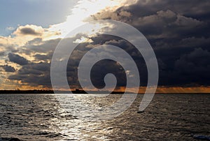 Storm clouds over the Black Sea coast at evening sunset.