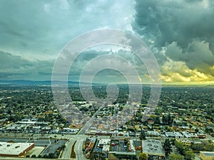 Storm clouds over city of Pasadena with a view of the sunset peaking from behind the clouds