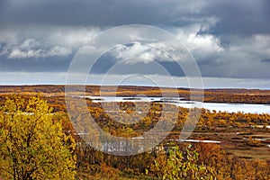 Storm clouds over a lake in the tundra in autumn. Kola Peninsula, Russia