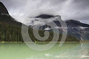 Storm clouds over mountain lake