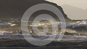 storm clouds over the sea. movement of sunlight before the storm. Seaside town of Turgutreis and spectacular sunsets.