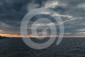 Storm clouds over the sea at sunset. Seascape. Beautiful view of the sea and sunset. Beautiful nature landscape