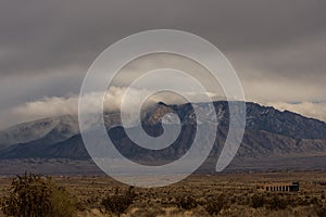 Storm clouds rolling in over the Sandia Mountains in Albuquerque New Mexico