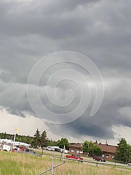 Storm clouds rolling over top of the R.C.M.P. station in Rocky Mountain House Alberta Canada