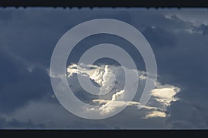 Storm clouds with sunlight breaking through