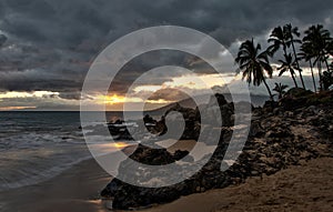 Storm clouds at sunset on the Hawaii beach