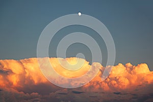 Storm clouds at sunset with moon