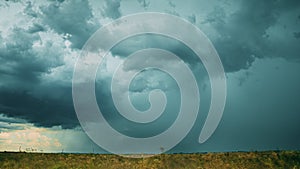 Storm Cloudy Rainy Sky. Dramatic Sky With Dark Clouds In Rainy Day. Storm And Rain Above Summer Field. Time Lapse