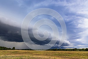 Storm cyclone over rural landscape