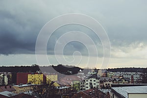 Storm dark clouds over city