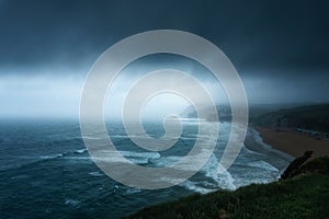 Storm with dark clouds over sea in Sopelana