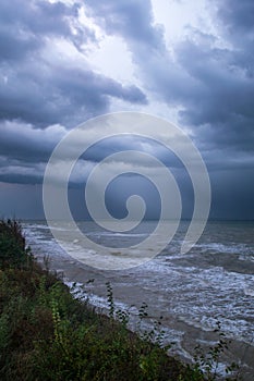 Storm front over water with wall of rain