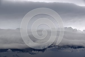 Storm hurricane blue leaden torn clouds on the horizon