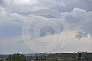 Storm hurricane blue leaden torn clouds on the horizon