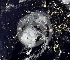 Storm Laura over USA at night, view of tropical hurricane eye from space. Elements of this image furnished by NASA