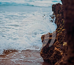 Storm in the ocean, sea waves crashing on rocks on the beach coast, nature and waterscape