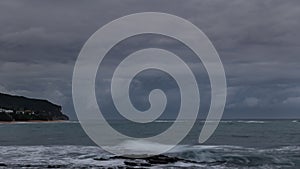 Storm over the ocean timelapse at dusk