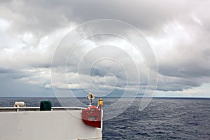 Before the storm. A painted view of storm and rain clouds and the sky above the sea horizon.