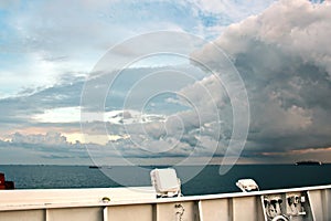 Before the storm. A painted view of storm and rain clouds and the sky above the sea horizon.