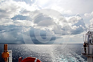 Before the storm. A painted view of storm and rain clouds and the sky above the sea horizon.