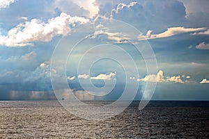 Before the storm. A painted view of storm and rain clouds and the sky above the sea horizon.