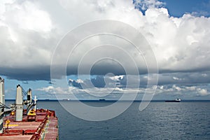 Before the storm. A painted view of storm and rain clouds and the sky above the sea horizon.