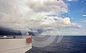 Before the storm. A painted view of storm and rain clouds and the sky above the sea horizon.