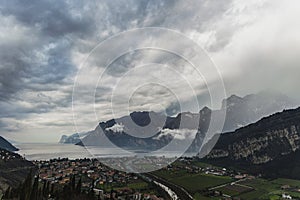 Storm passing over dark mountains above Lake Garda Limone Sul Garda, Lago di Garda, Italy