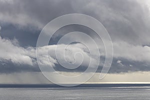 Storm and rain clouds coming over the Atlantic Ocean near Faial Fayal Island in the Azores