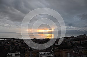 Dramatic stormy blue sky with sun goes through clouds