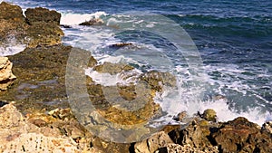 Storm at sea. Big waves break on the rocky shore