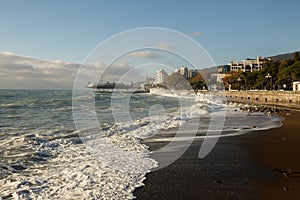 Storm at the sea and embankment street of Yalta city in Crimea in the morning on 24.10.2016. Big waves and tides wash