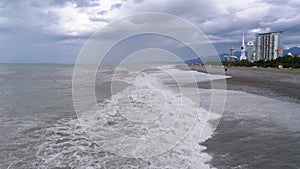 Storm on the Sea. Huge waves are crashing and spraying on the shore. Batumi, Georgia