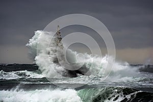 Storm in the Sea. Lighthouse in the port of Ahtopol, Black Sea, Bulgaria