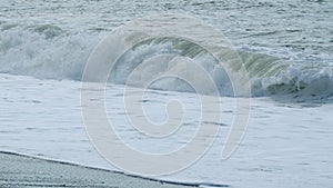 Storm At Sea. Wave With Texture And Wind Spray. Beautiful Dark Sea Surface In Day. Slow motion.