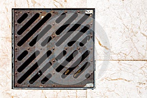 The storm shower iron grate.