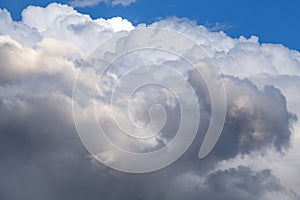 Storm sky. Big white cumulus clouds against blue sky background, cloud abstract texture, thunderstorm