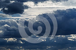 storm sky, dark dramatic clouds during thunderstorm, rain and wind, extreme weather, abstract background