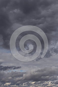 Storm sky. Dark grey big cumulus clouds background, cloud texture, thunderstorm