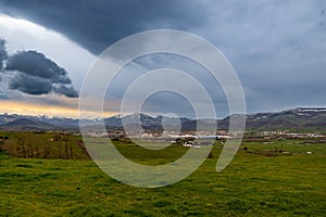 storm and sunset landscape with church in Spain