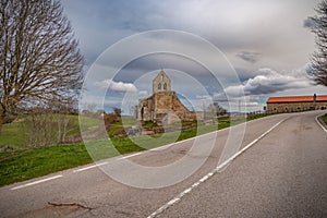 storm and sunset landscape with church in Spain