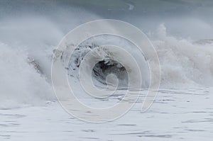 Storm waves breaking at Harlyn Bay on the North Cornwall Coast, England, UK during Storm Frank 2015