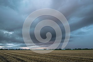 Stormcloud with lightning strikes on the horizon