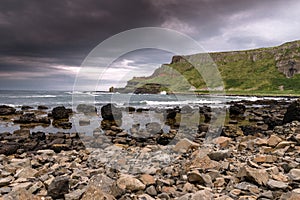 Stormclouds over coast in northern ireland at Giants Causeway