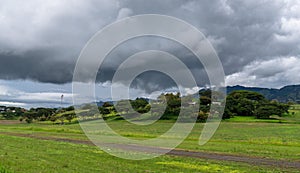 Stormy afternoon with many clouds over the country house. photo