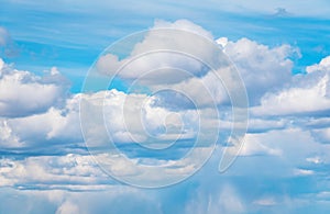 Stormy blue sky background with fluffy huge clouds. Sunny blue sky background with clouds.