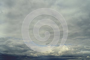 Stormy clouds background. Dramatic stormy sky with dark heavy clouds. The texture of the clouds