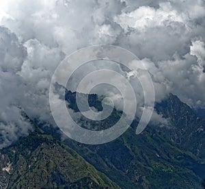 Stormy clouds on Himalayan valley and agricultural land